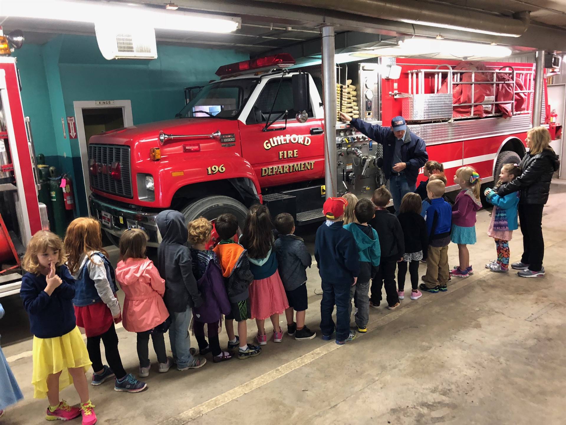 Fireman talks to students about fire safety and fire trucks!