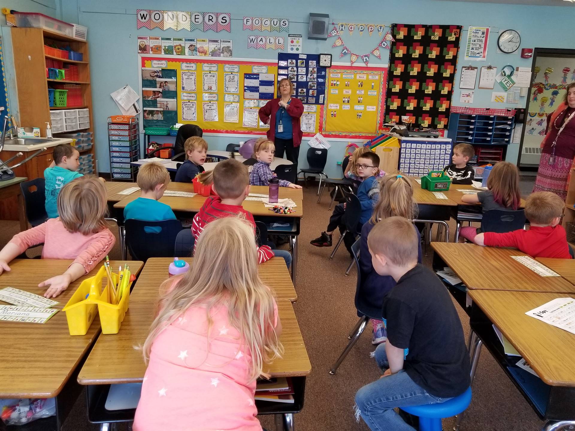 The school nurse demonstrates safe hand washing.