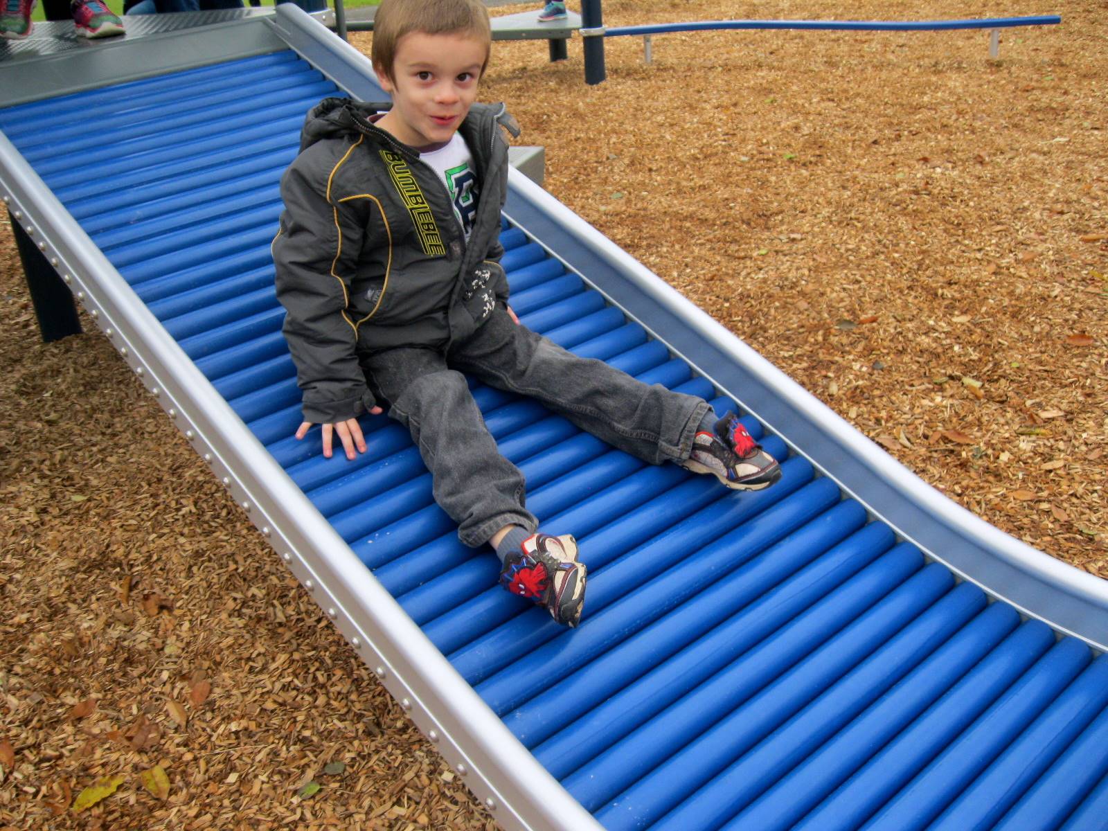 A child on a slide.
