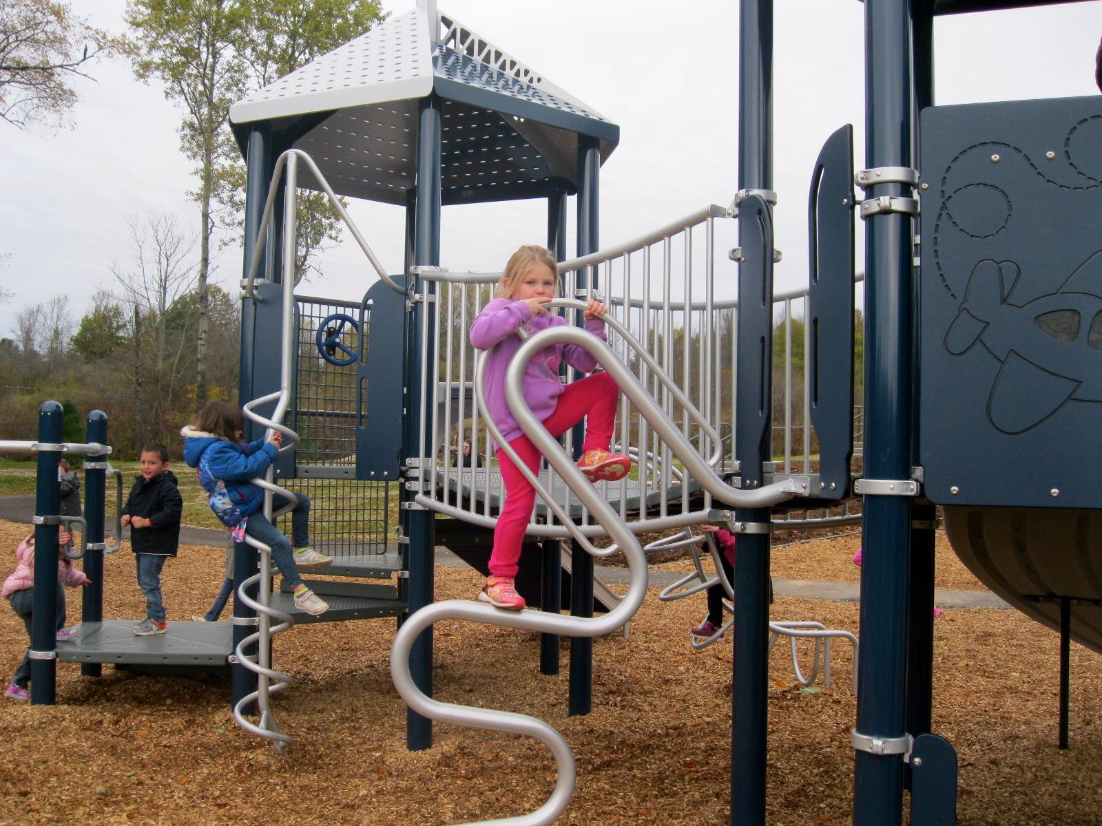 A child climbs on the new playground!