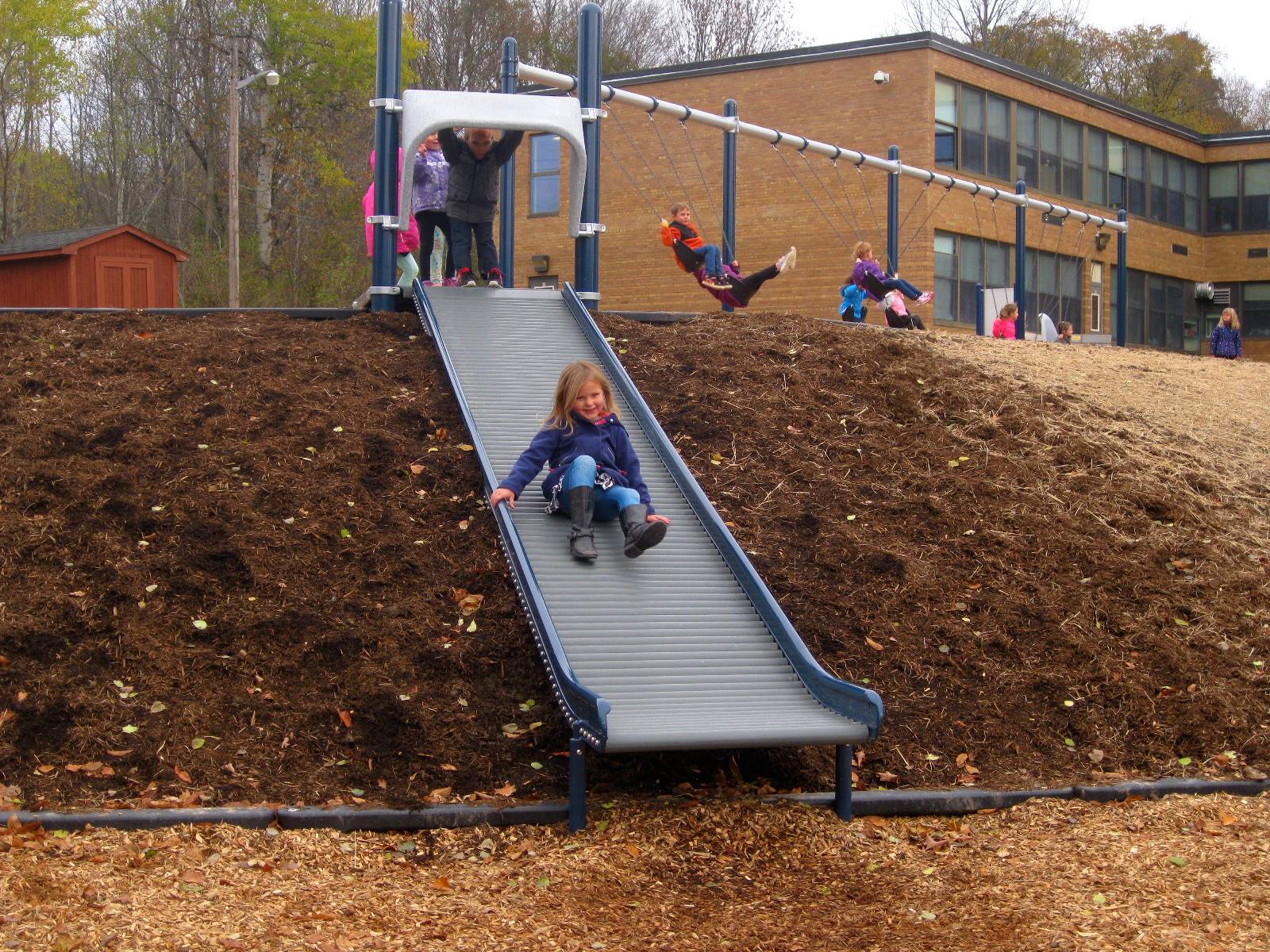 kids on roller slide.