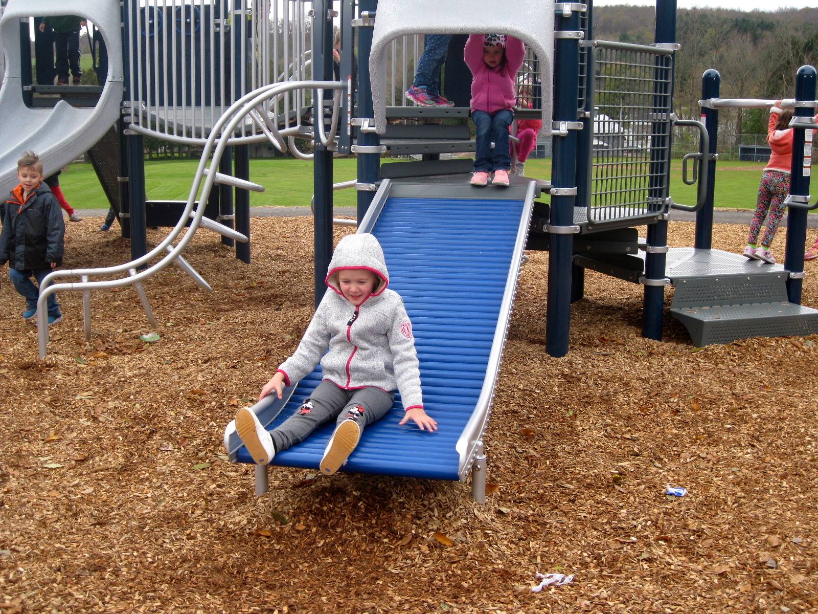 kids on roller slide.