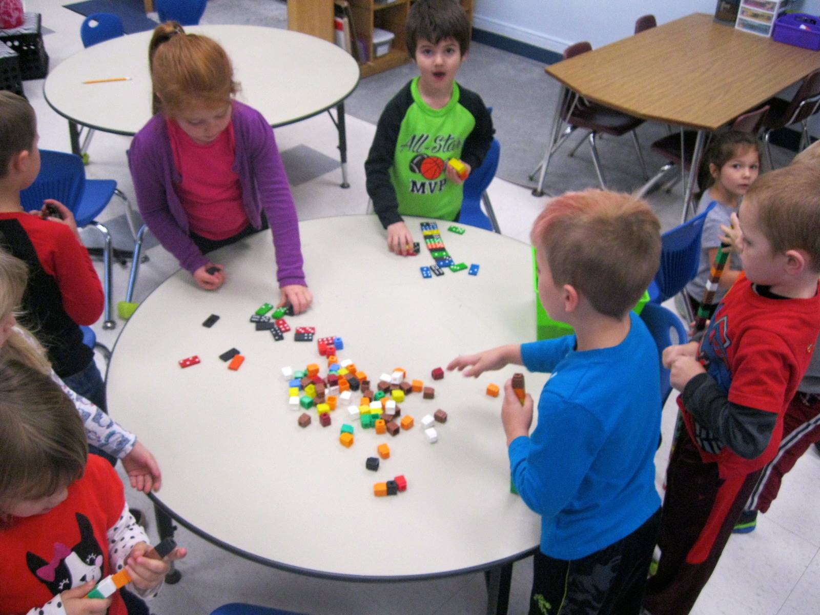 Children build together.