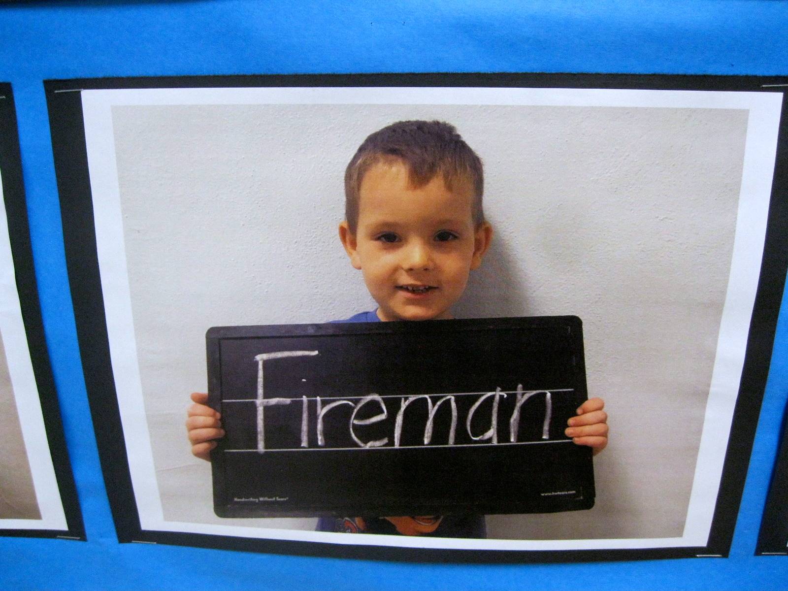 Child holding sign to show what they want to be when they grow up.