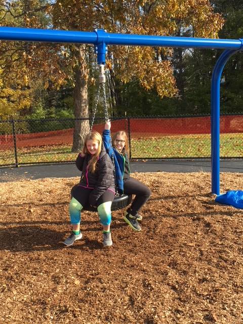 Students on the tire swing