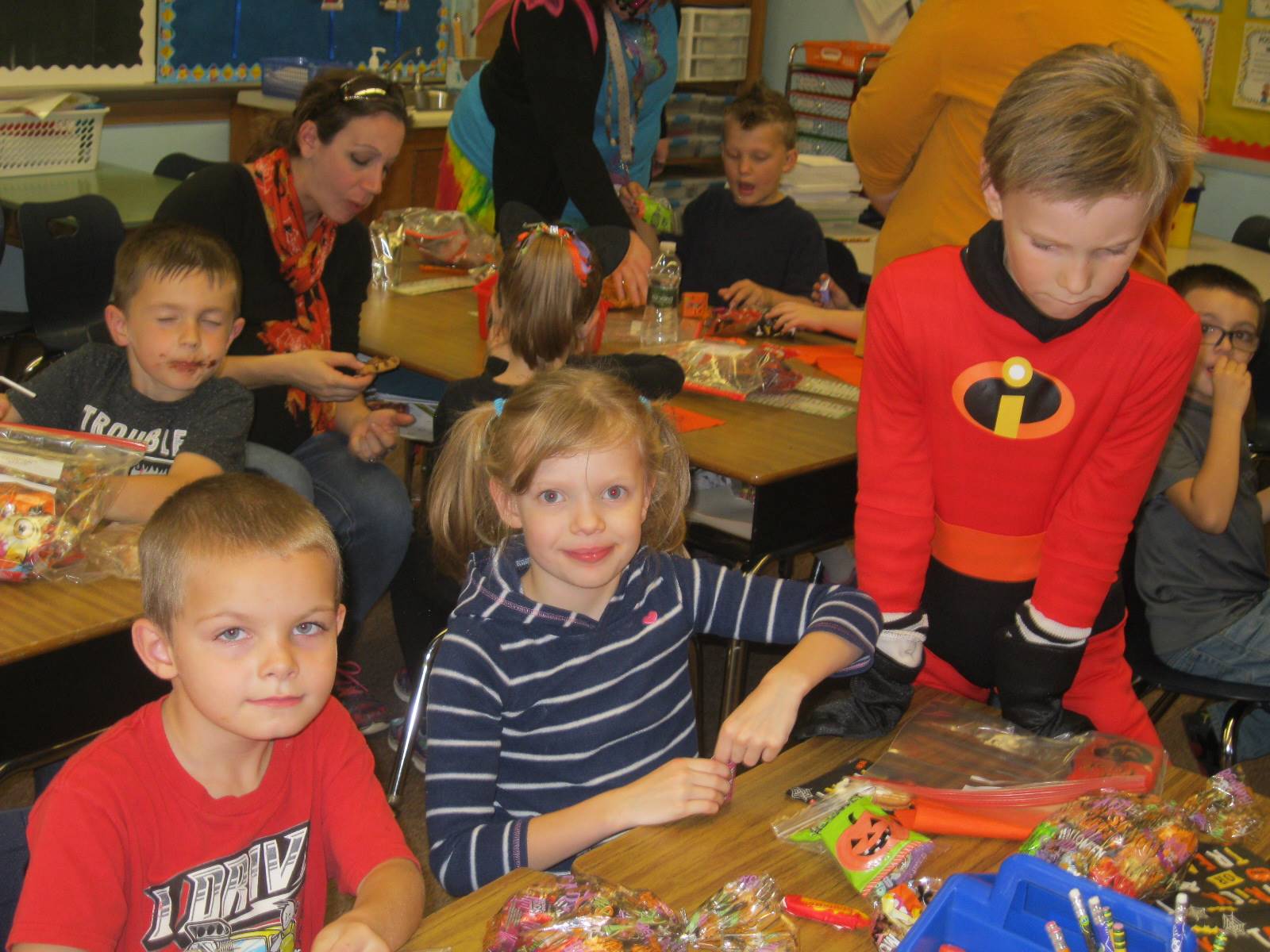 students enjoy halloween party food.