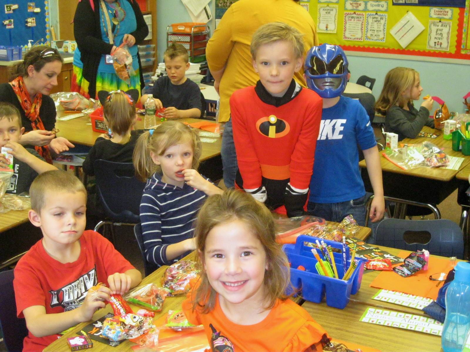 students enjoy halloween party food.