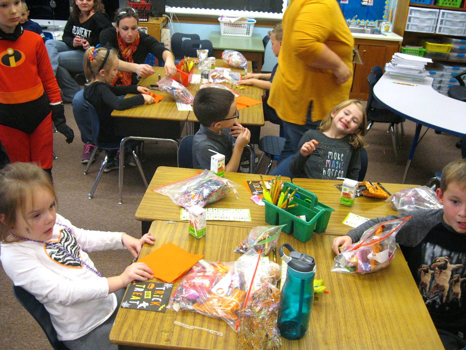 students enjoy halloween party food.