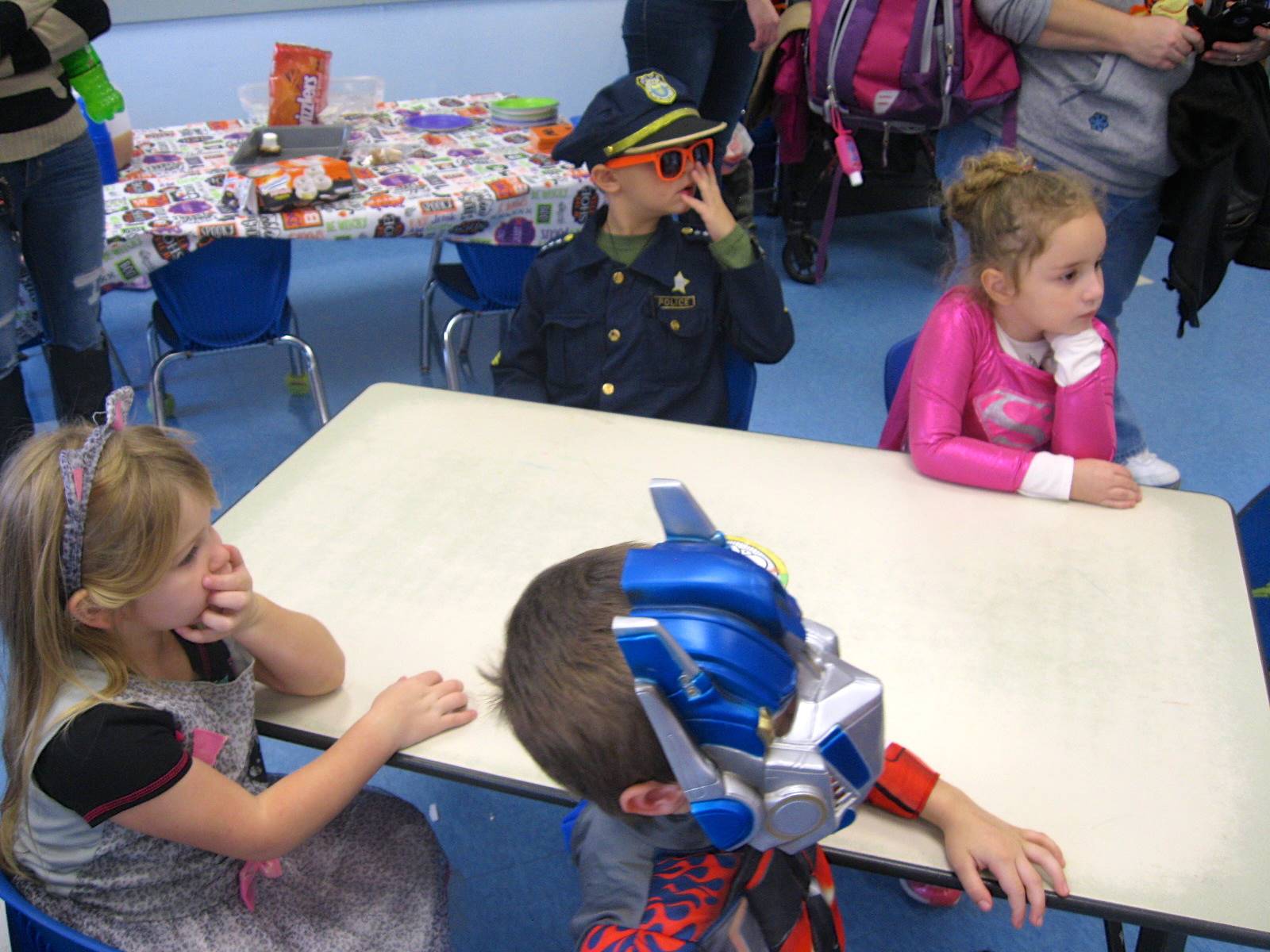 students enjoy halloween party food.