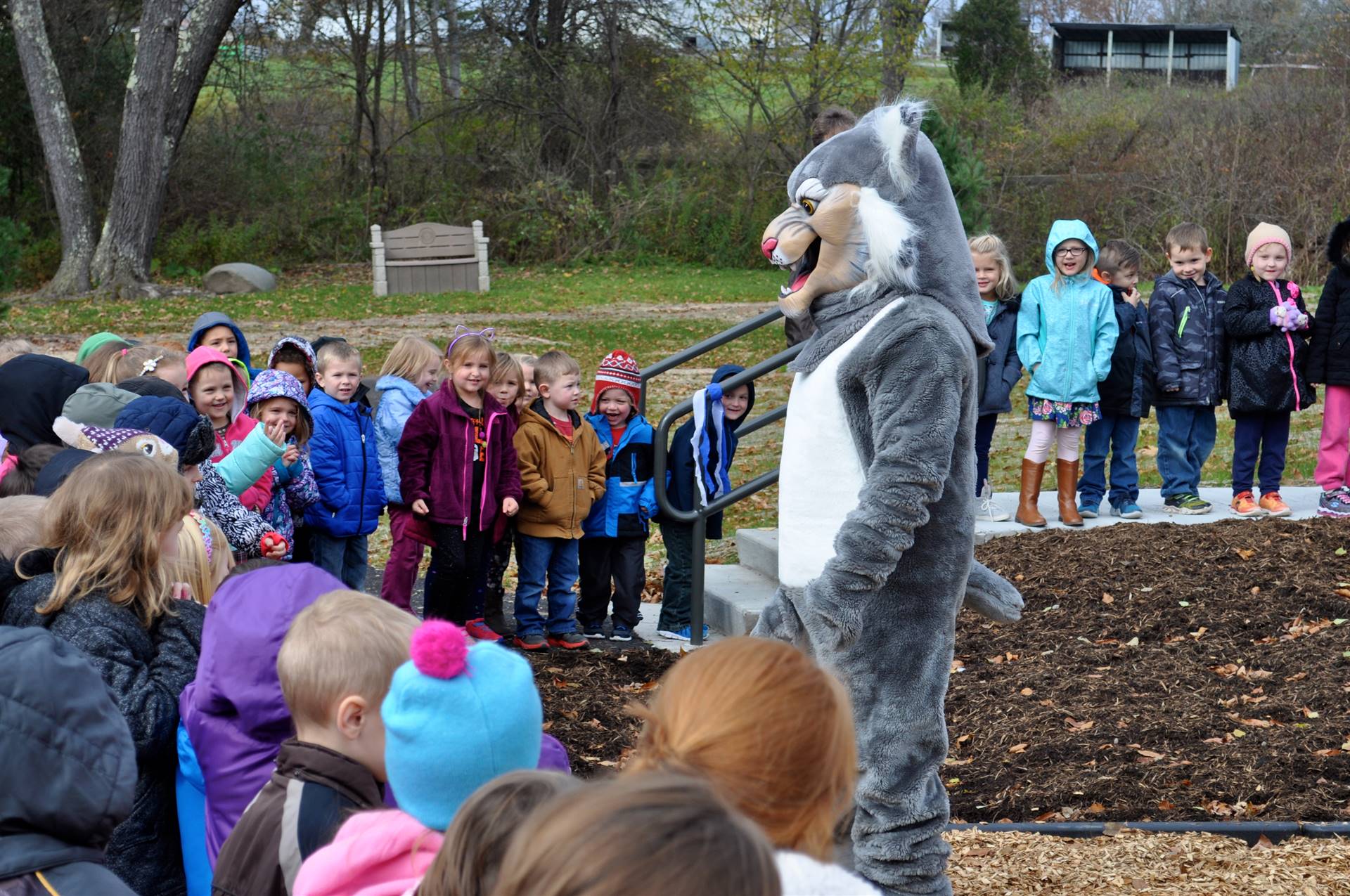 Felix Bobcat with kids at Guilford playground.