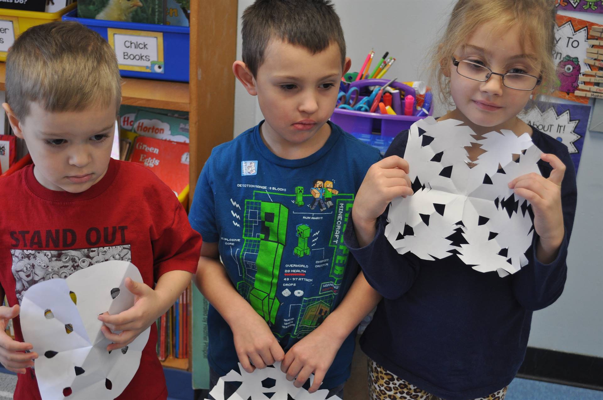 3 students show snowflakes.