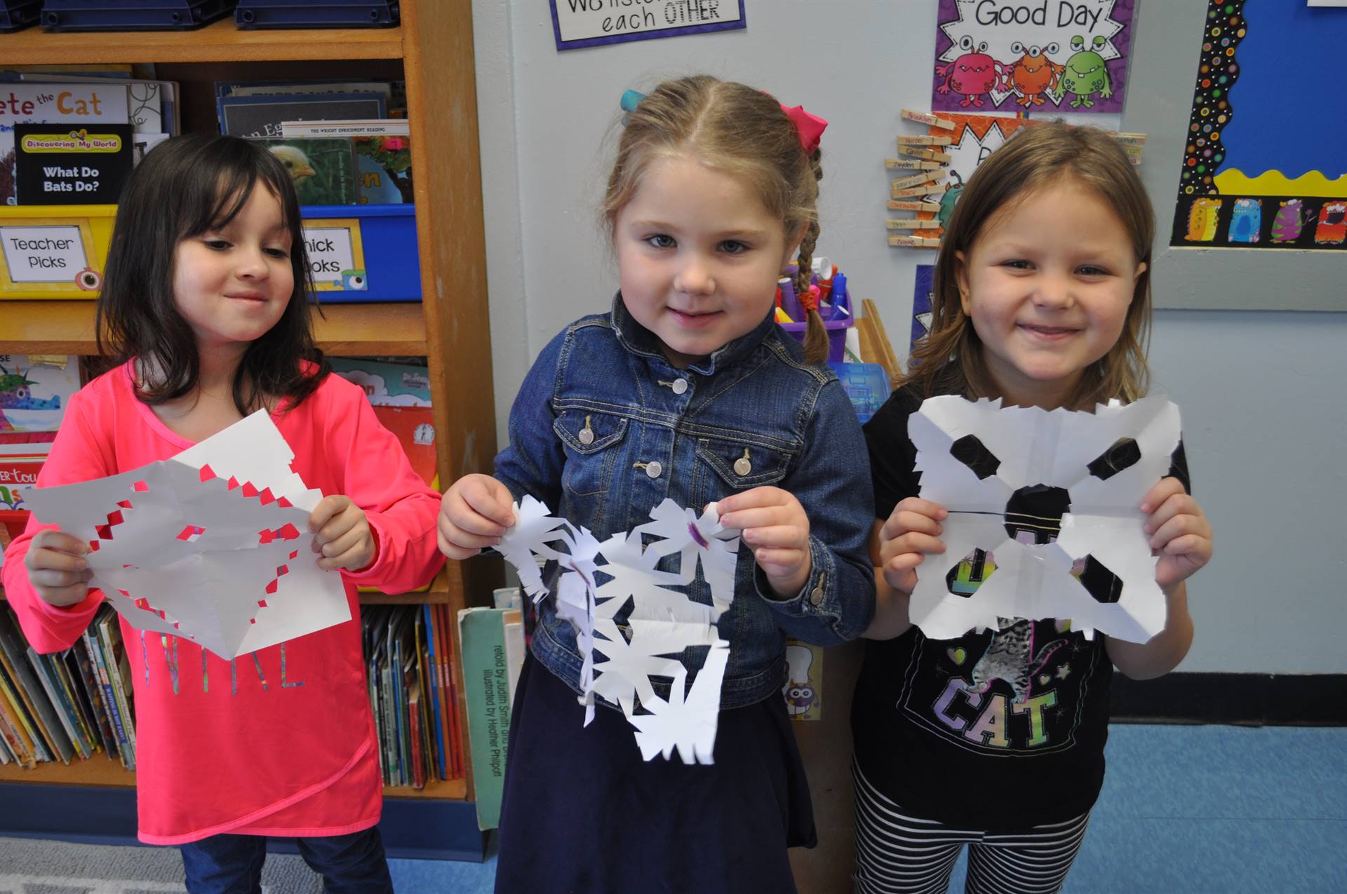 3 students show snowflakes.