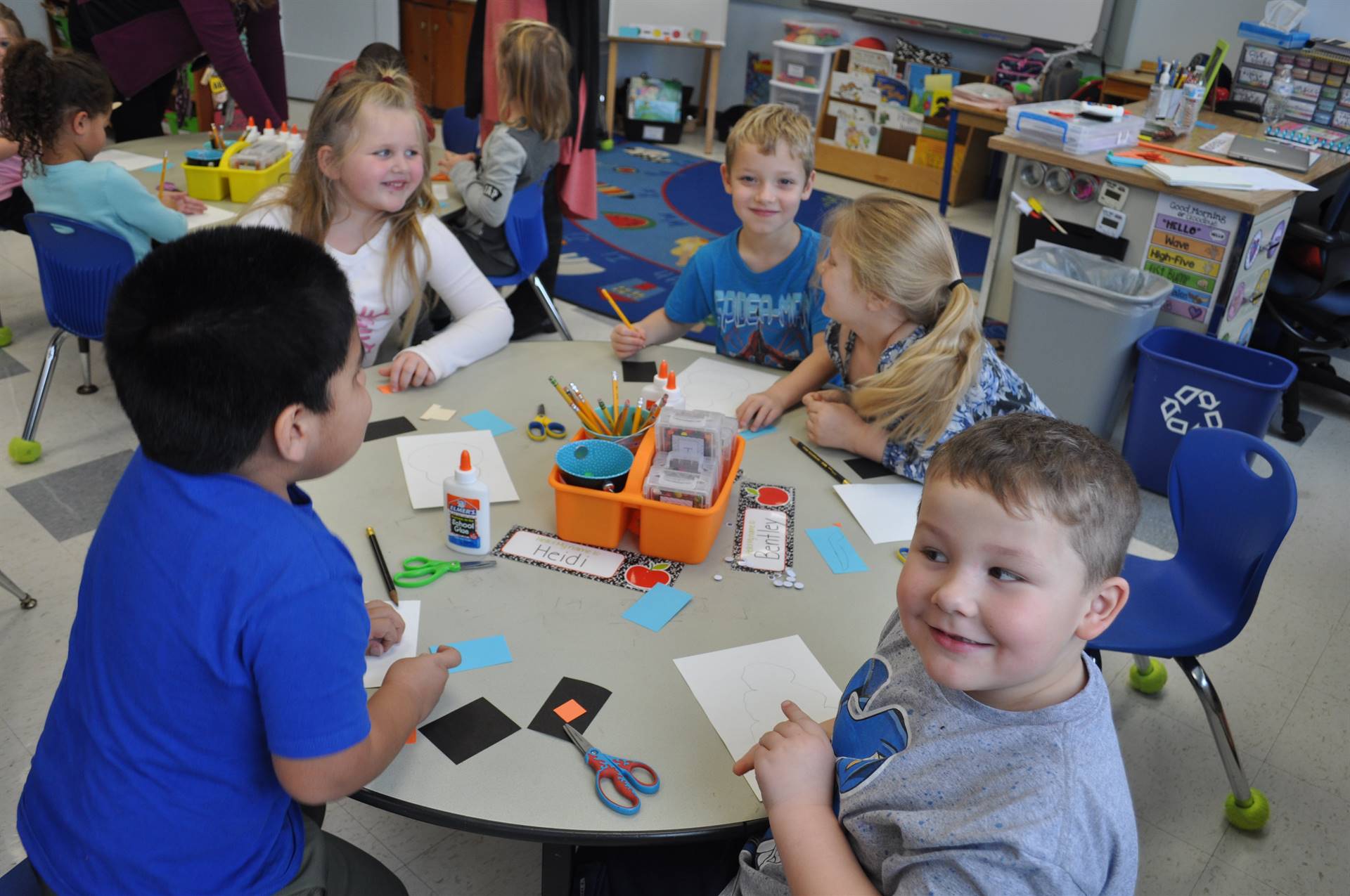 Students work together at a table.