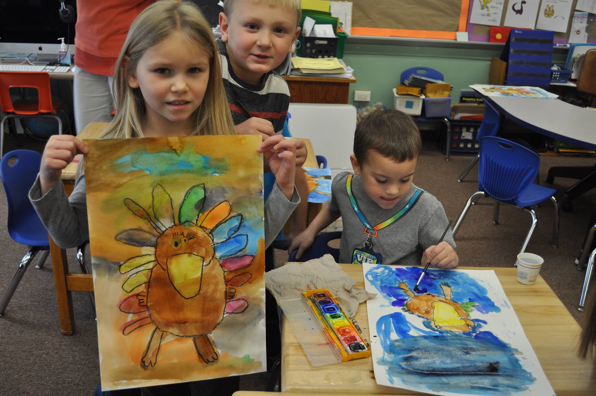 3 students watercolor painting.