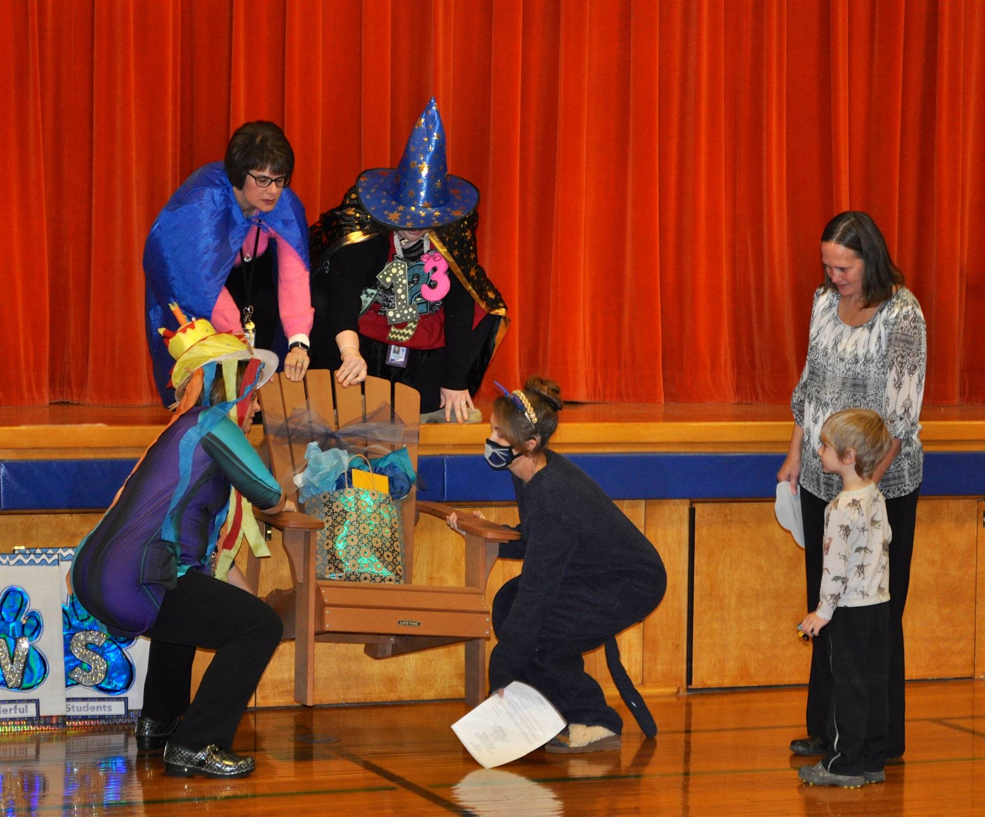Staff presents a chair to Mrs. Thompson