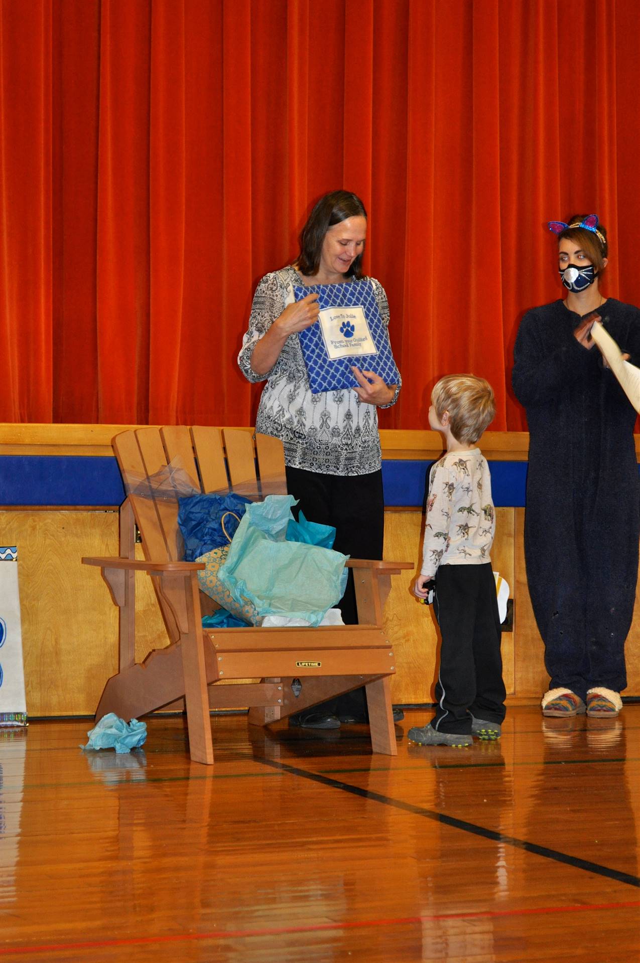 Mrs. Thompson shows her pillow with a PAW.