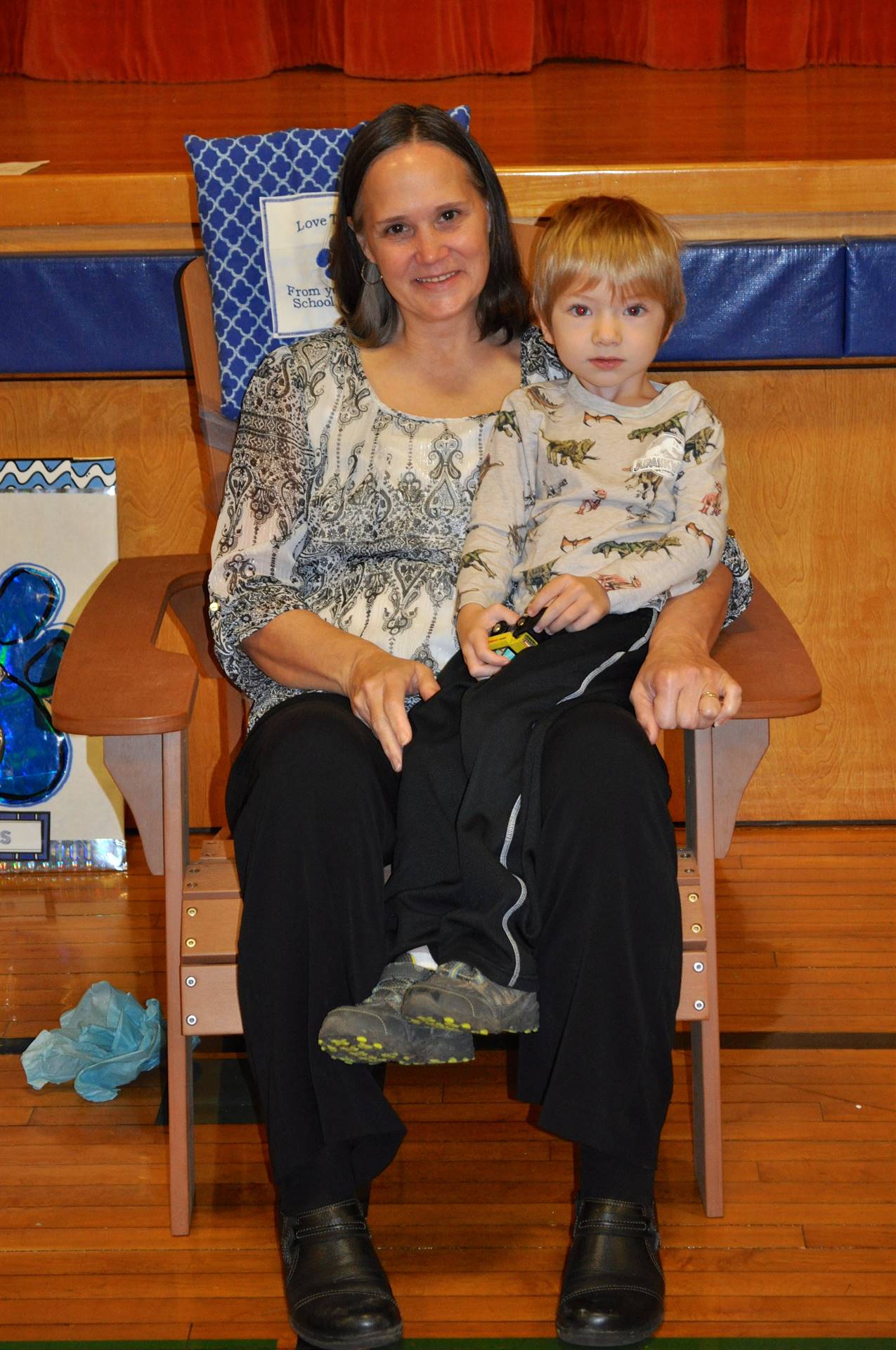 Mrs. Thompson and her grandson try out new chair.