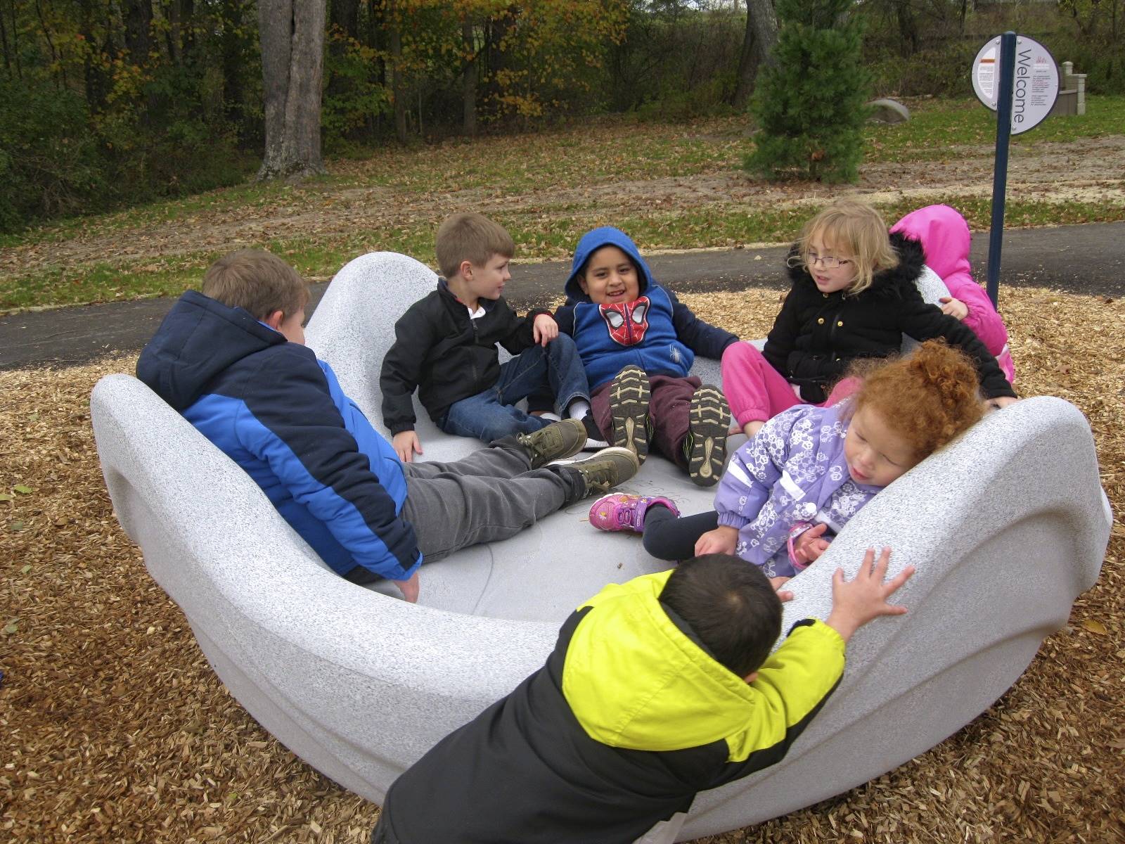 students on merry go round.