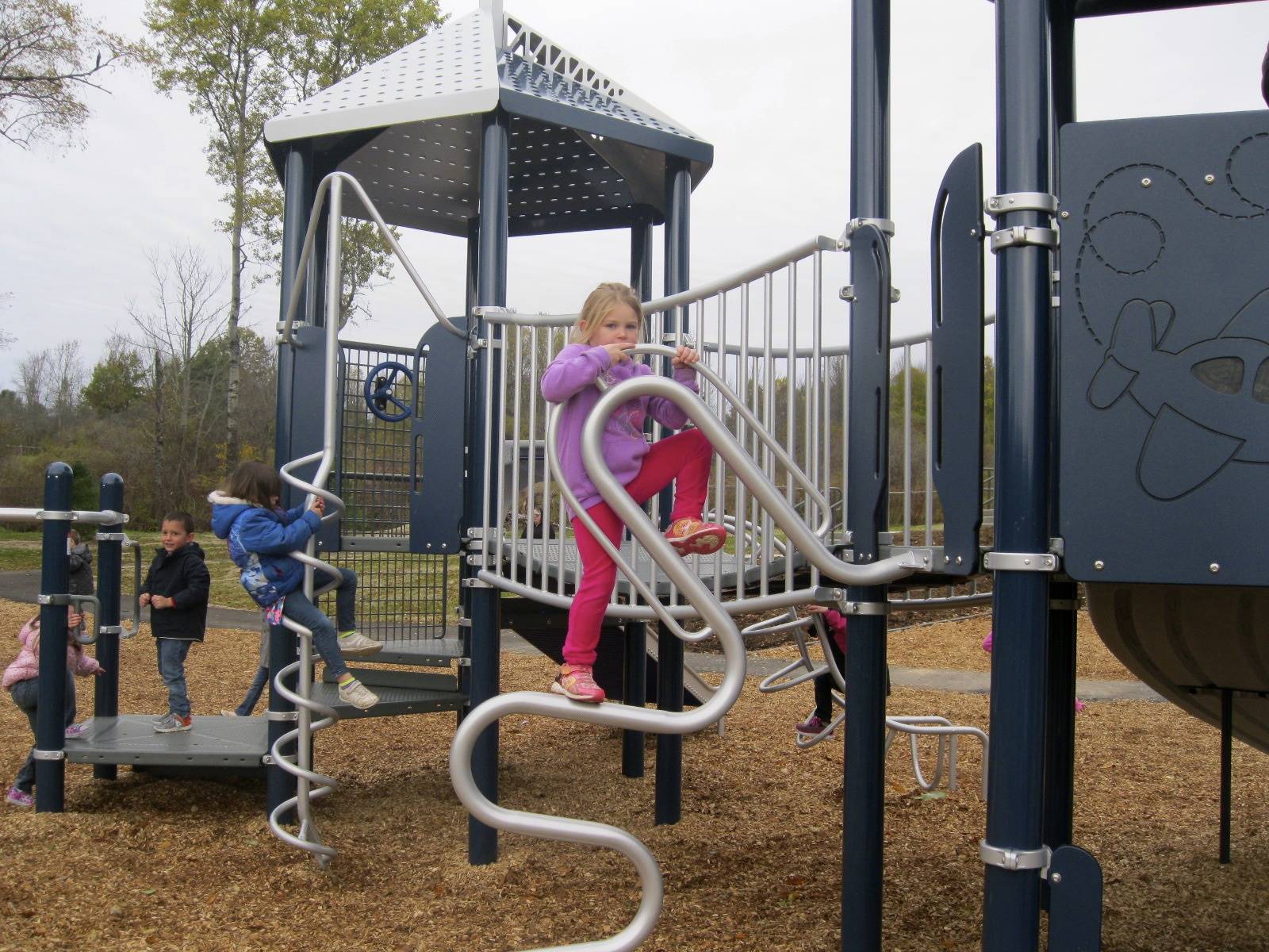 A student is climbing on playground.