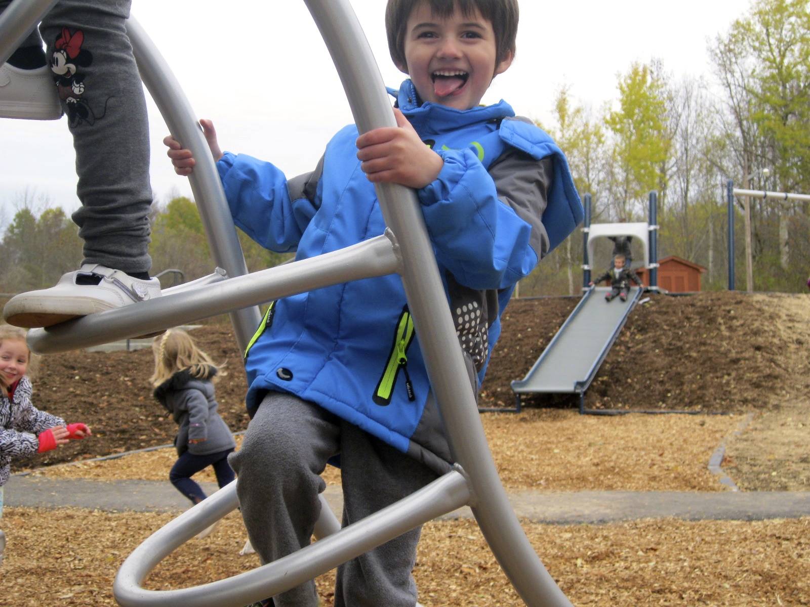 A student climbs on playground.