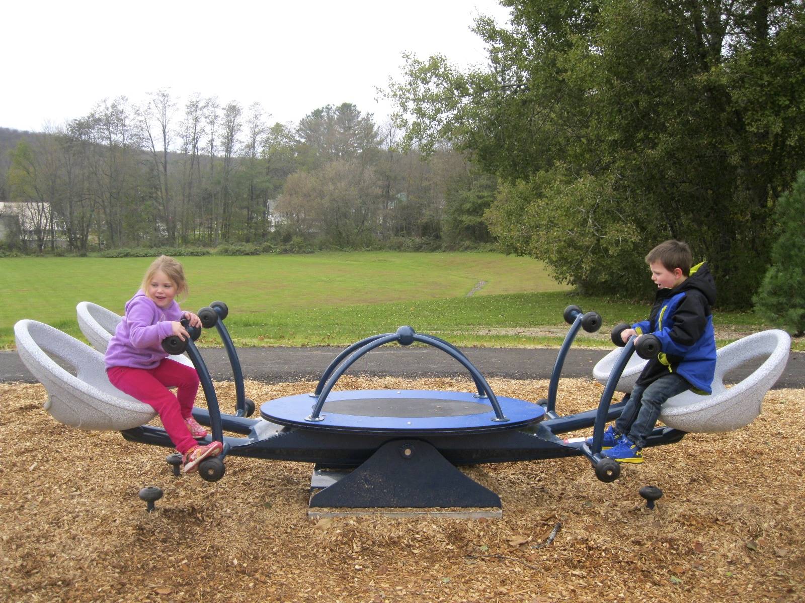 2 students try out teeter totter.