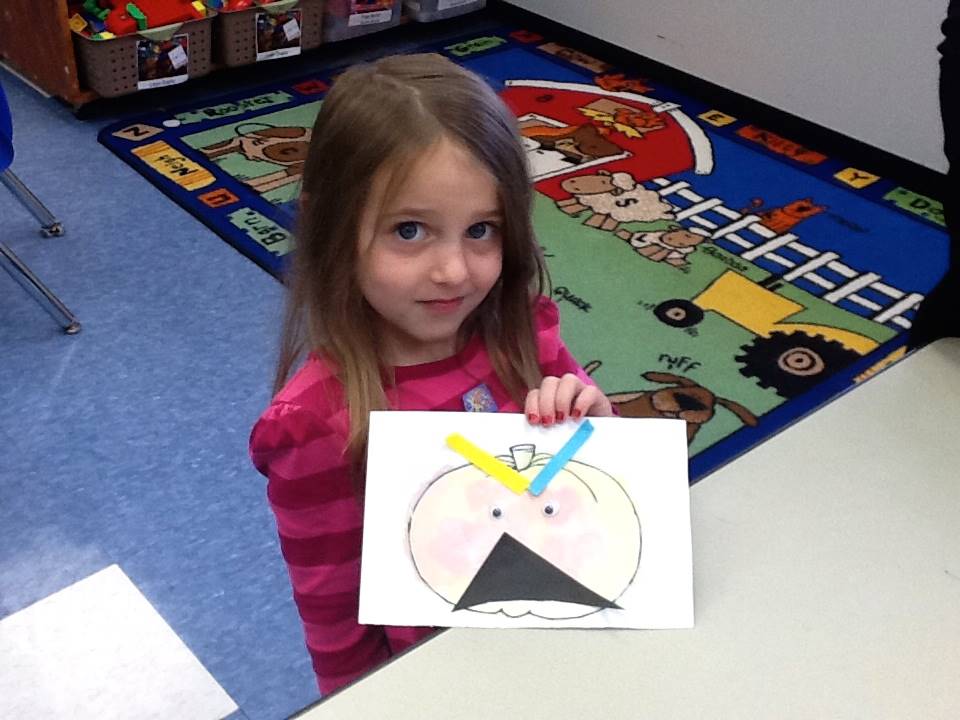 A student matches her emotion with her pumpkin's emotion.