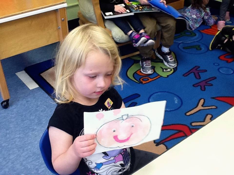 A student matches her emotion with her pumpkin's emotion.