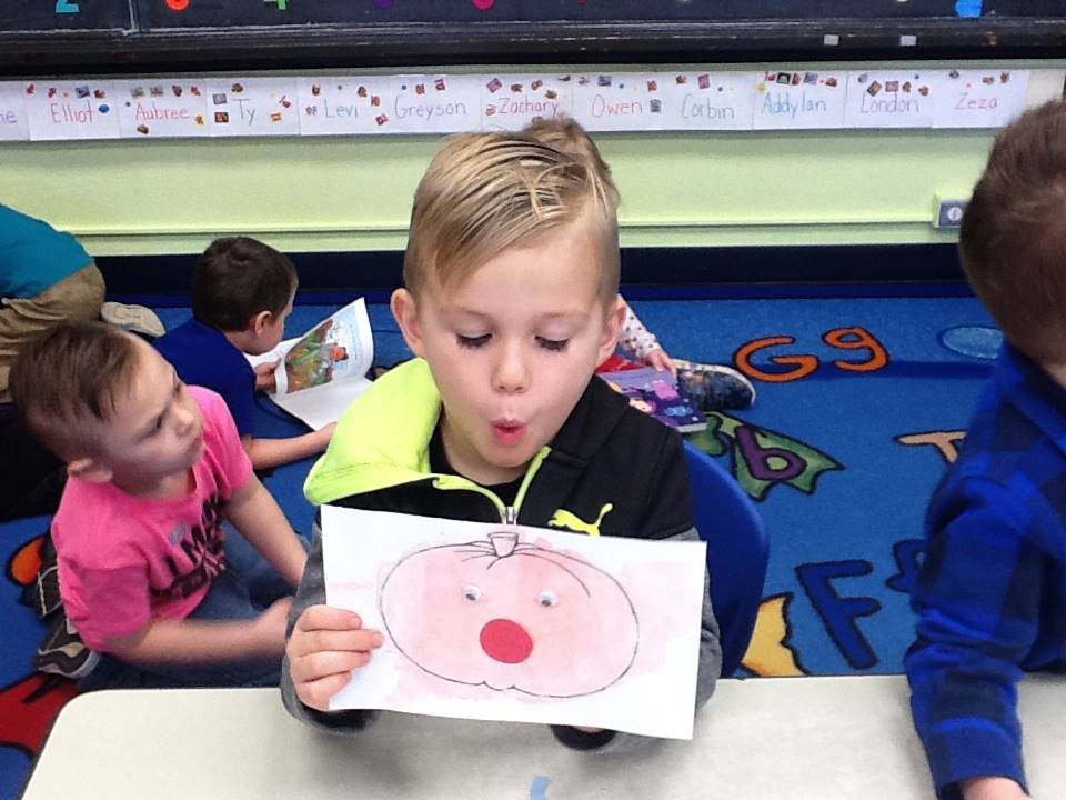 A student matches his emotion with his pumpkin's emotion.