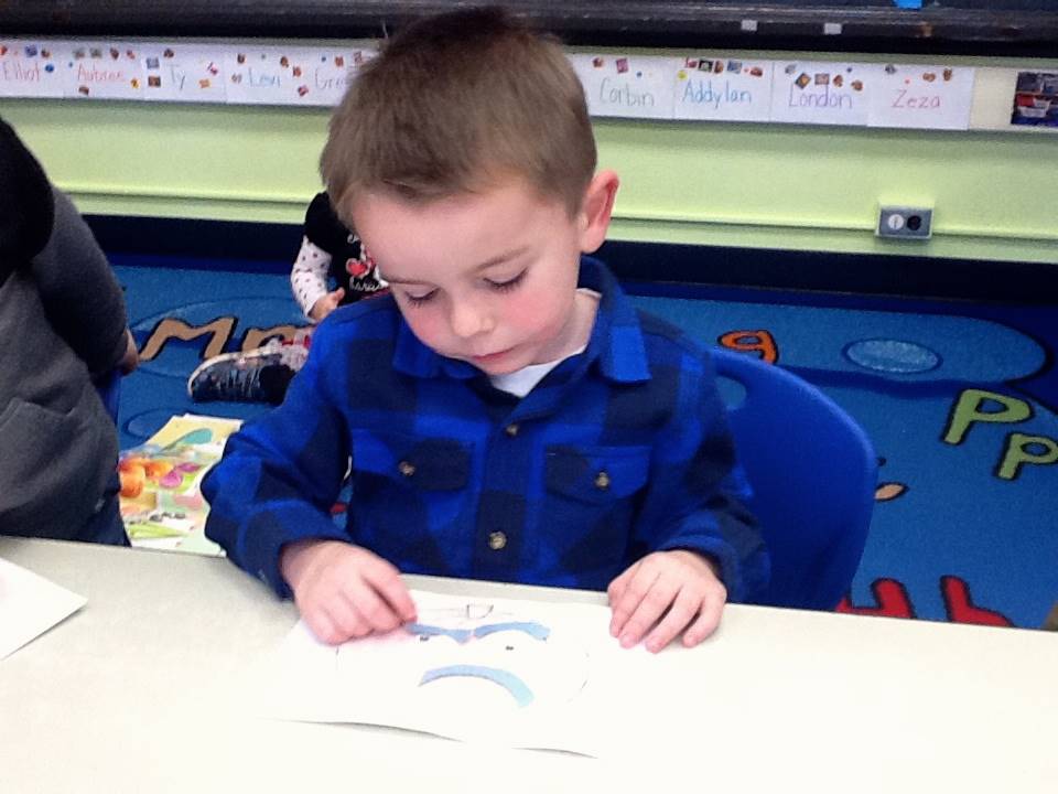 A student matches his emotion with his pumpkin's emotion.