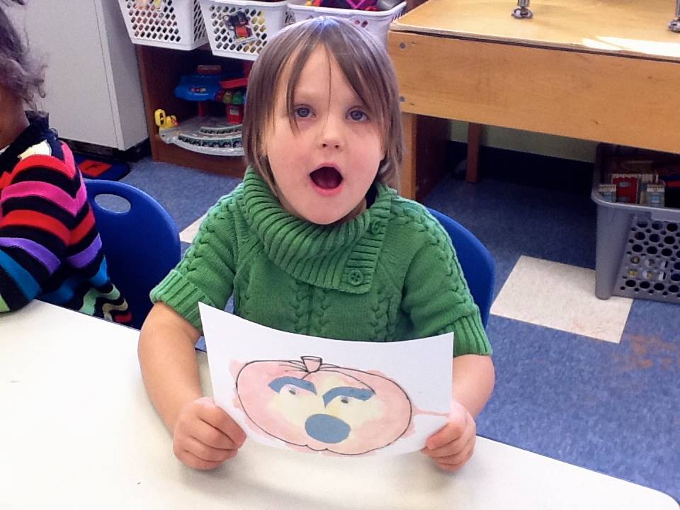 A student matches her emotion with her pumpkin's emotion.