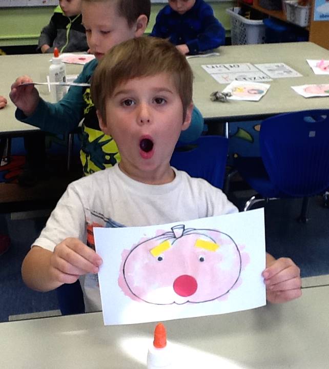 A student matches his emotion with his pumpkin's emotion.