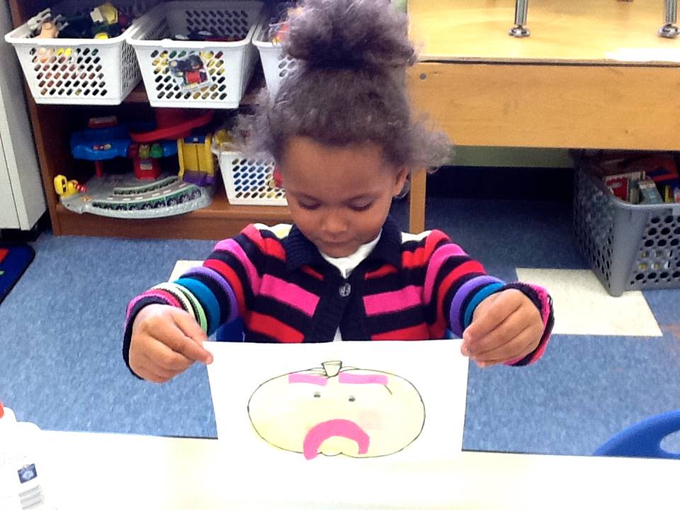 A student matches her emotion with her pumpkin's emotion.