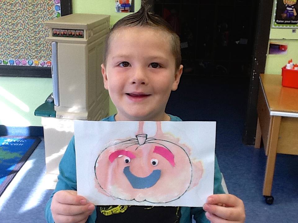 A student matches his emotion with his pumpkin's emotion.