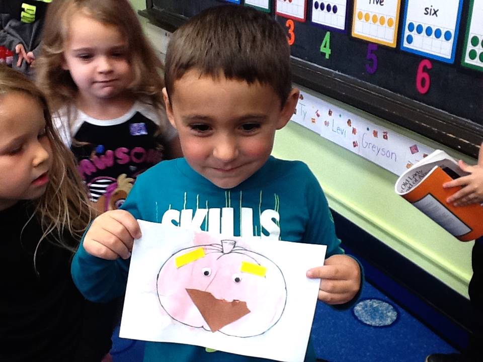 A student matches his emotion with his pumpkin's emotion.