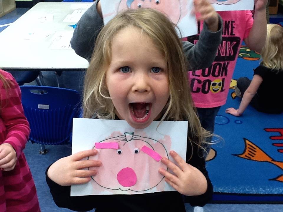 A student matches her emotion with her pumpkin's emotion.