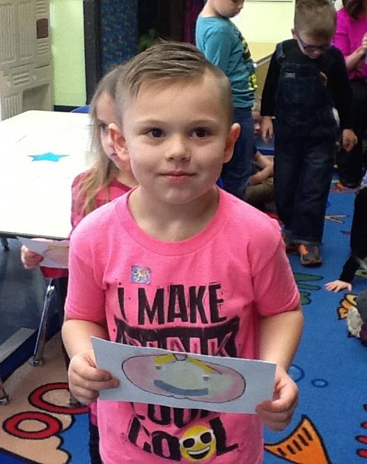 A student matches his emotion with his pumpkin's emotion.