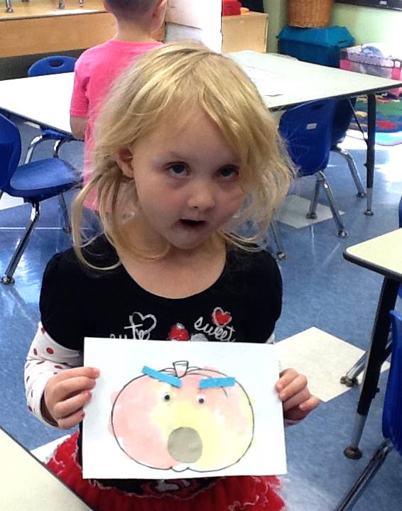 A student matches her emotion with her pumpkin's emotion.