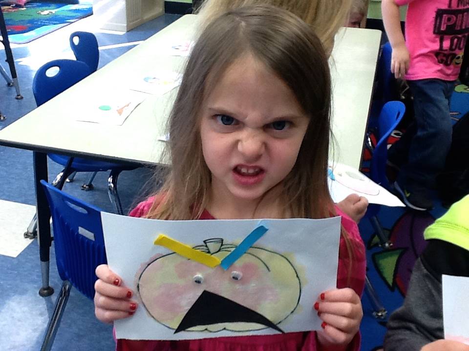 A student matches her emotion with her pumpkin's emotion.