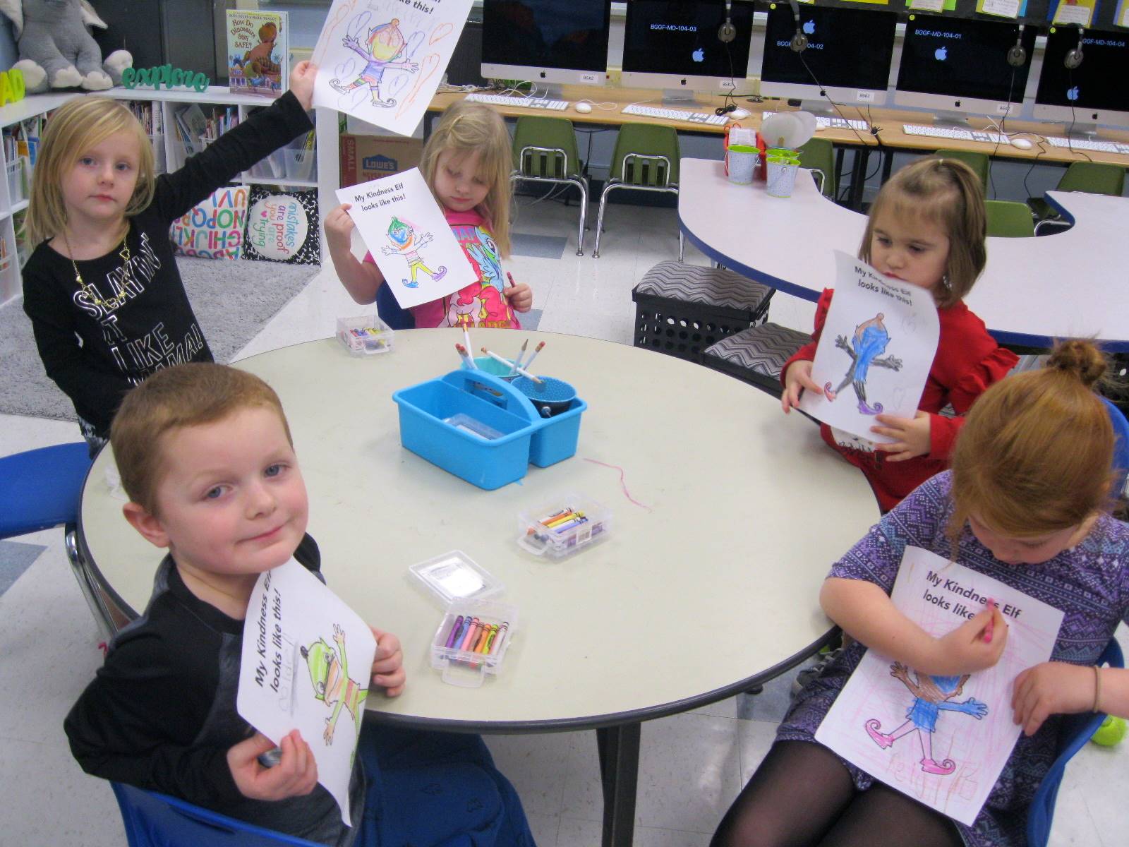 5 Students show their elf pictures.