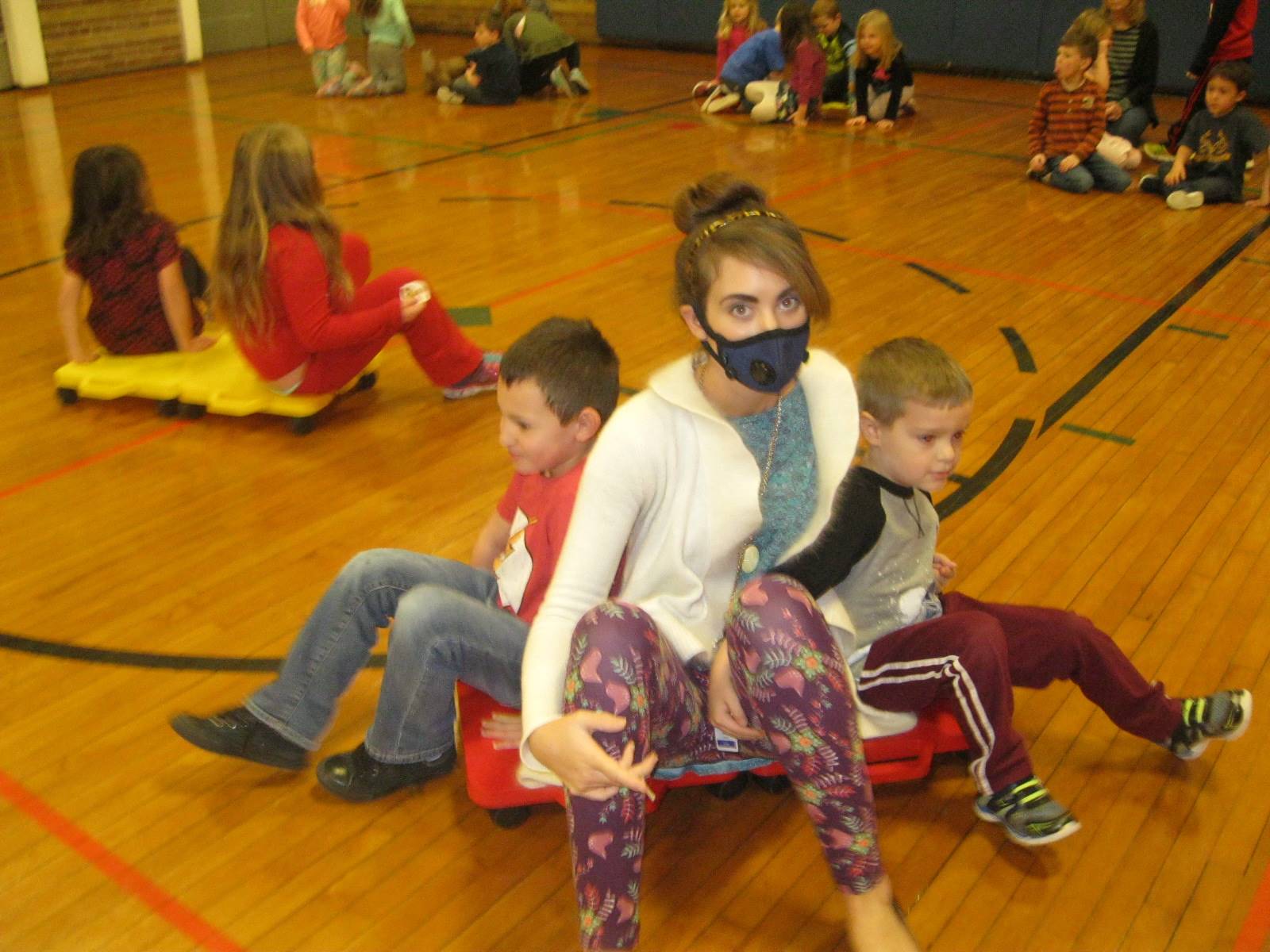 A teacher and 2 students on a scooter!