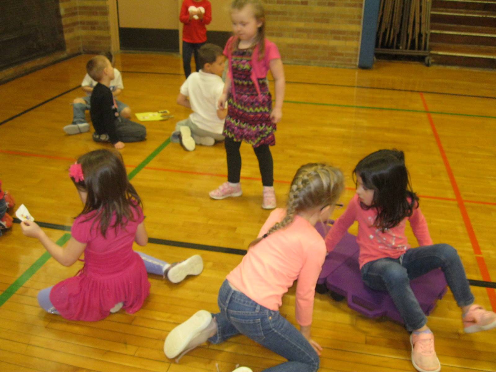 Students gathering responsible pictures for their puzzle pieces.