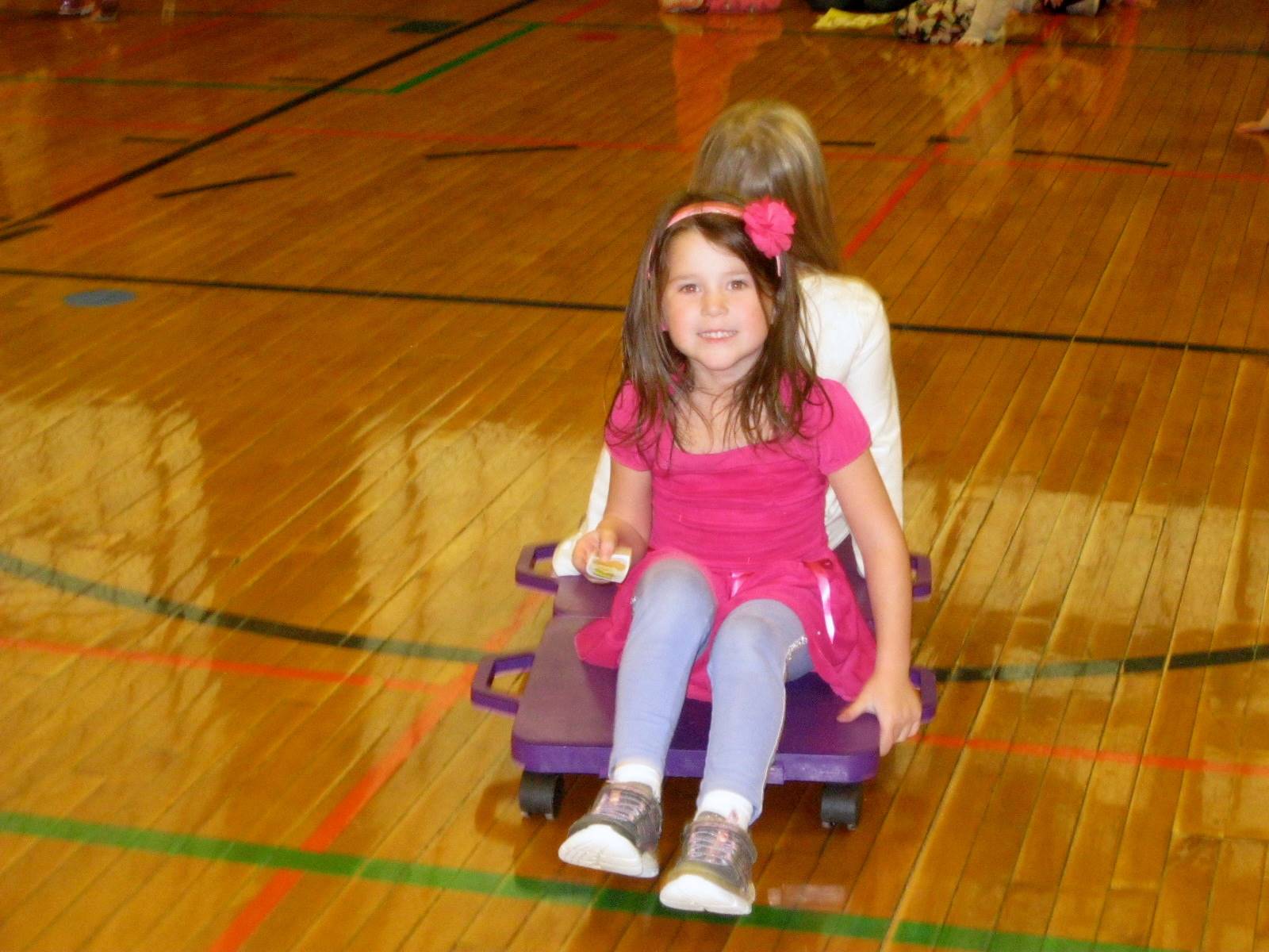 A student smiles on a scooter!