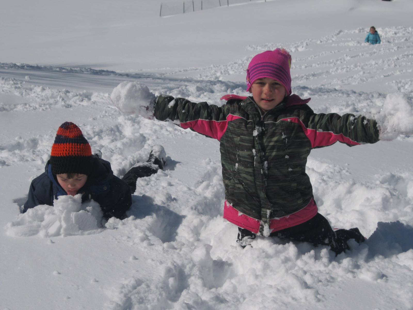 Children throwing and tasting snow.
