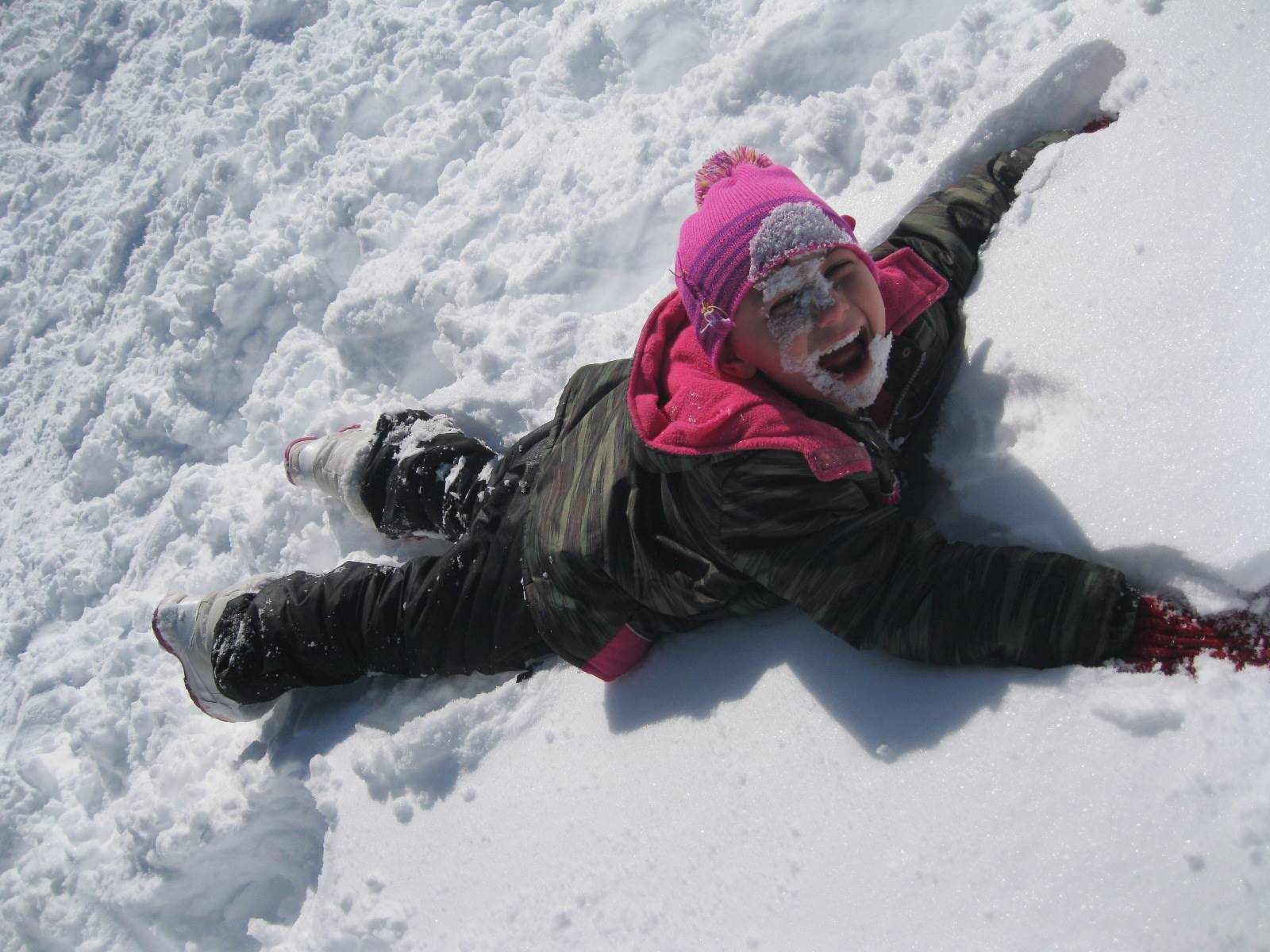 Child makes a snow face!