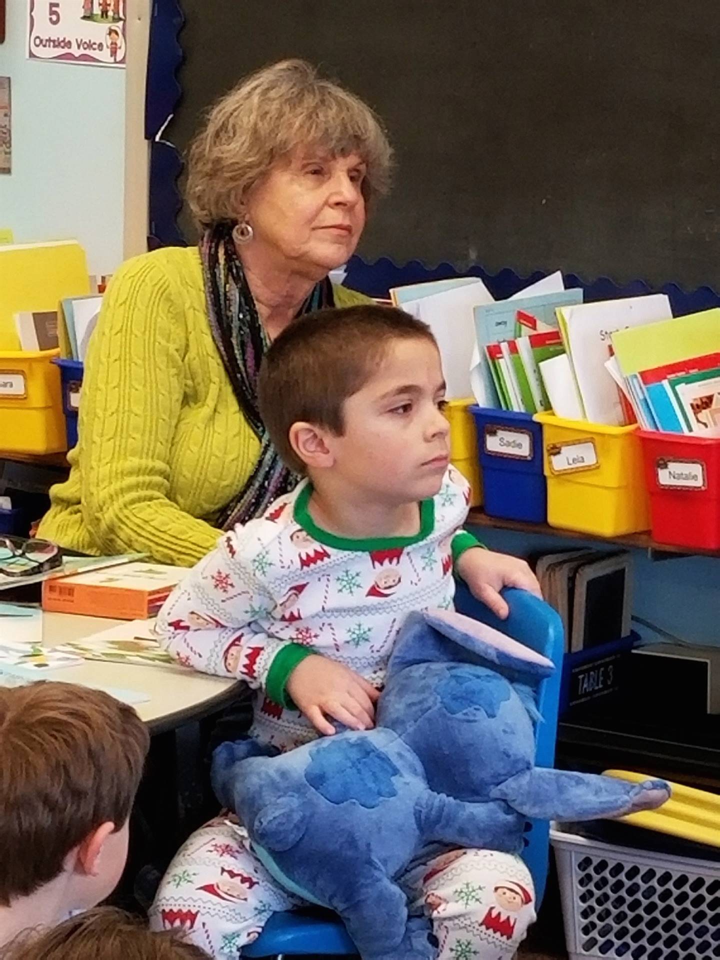 Grandmother and child listen to story.