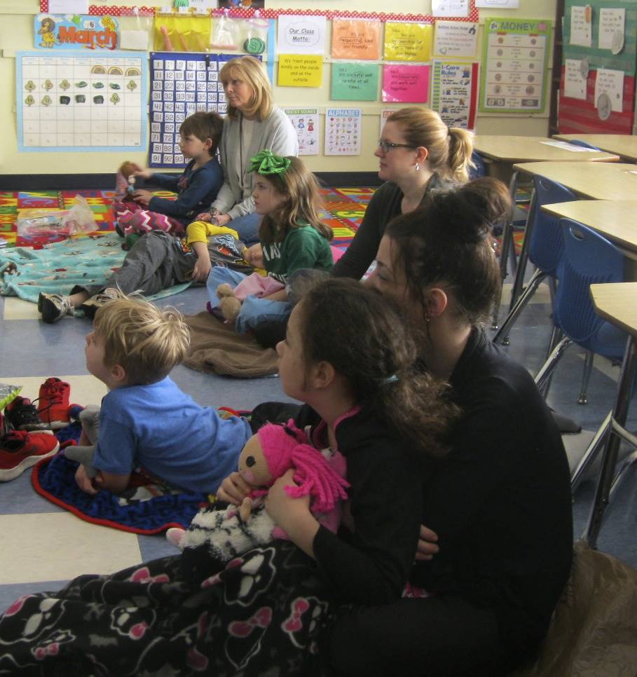 Students and parents listen to books during READ-IN.