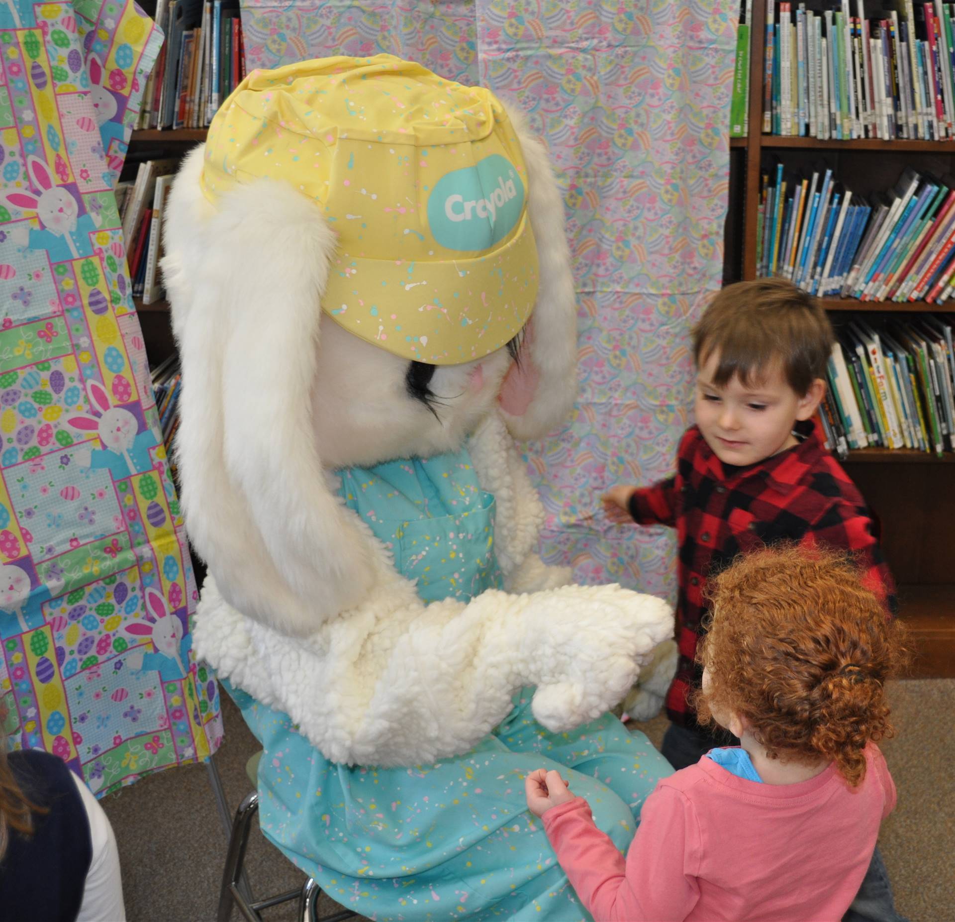 Students give Easter Bunny a high 5.