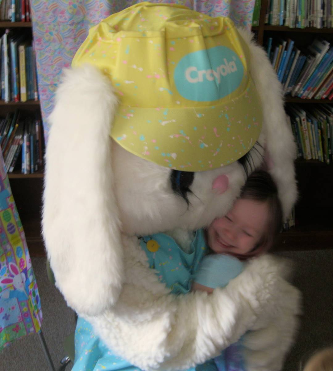 Student hugs Easter Bunny.