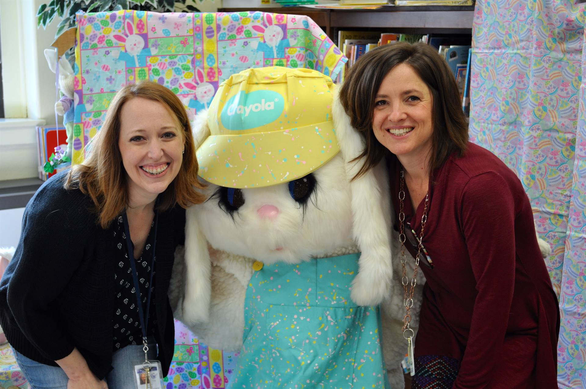 Mrs. Pain and Mrs. Figary standing with Easter Bunny. 