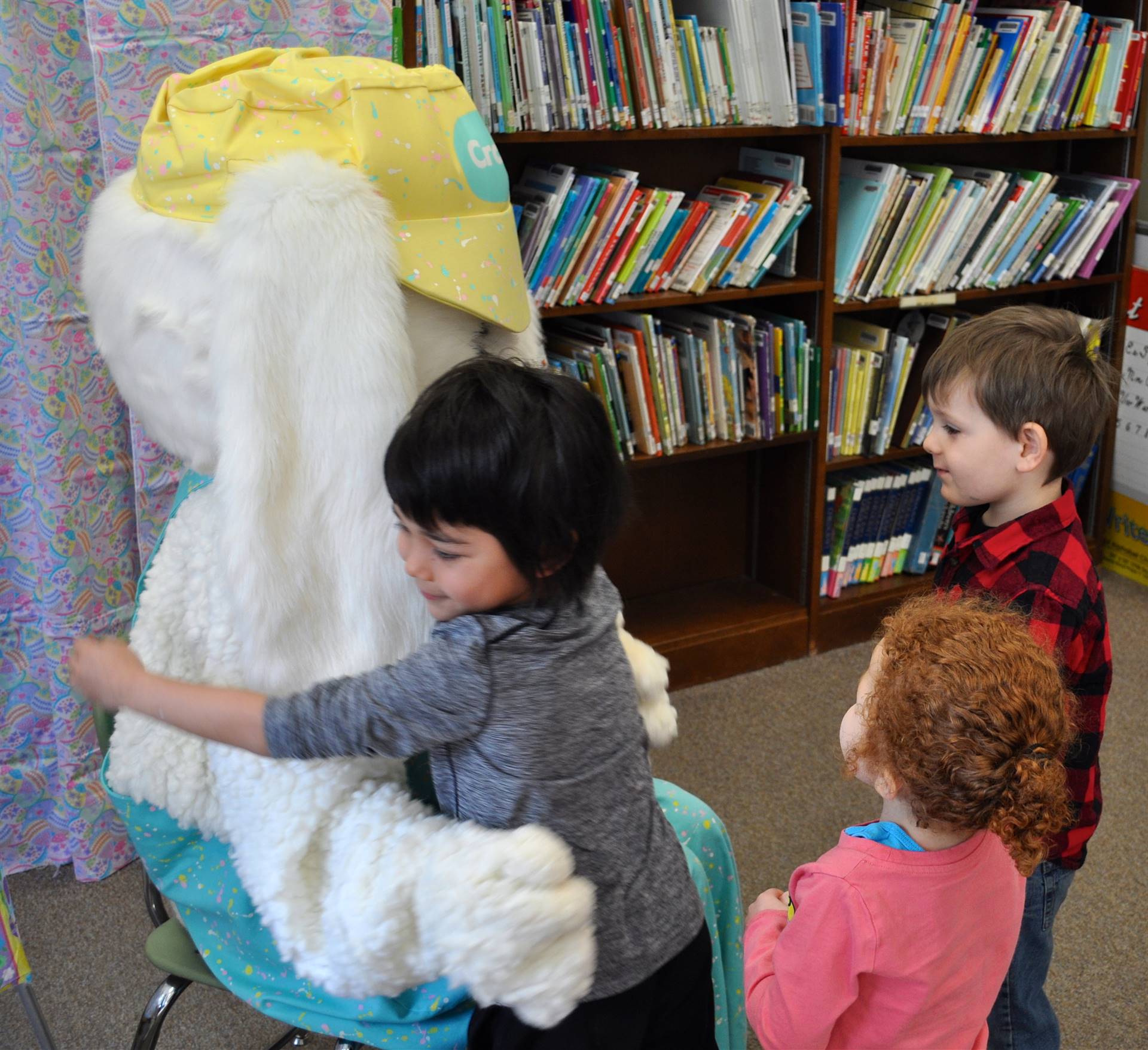 Student gives Easter Bunny a hug.